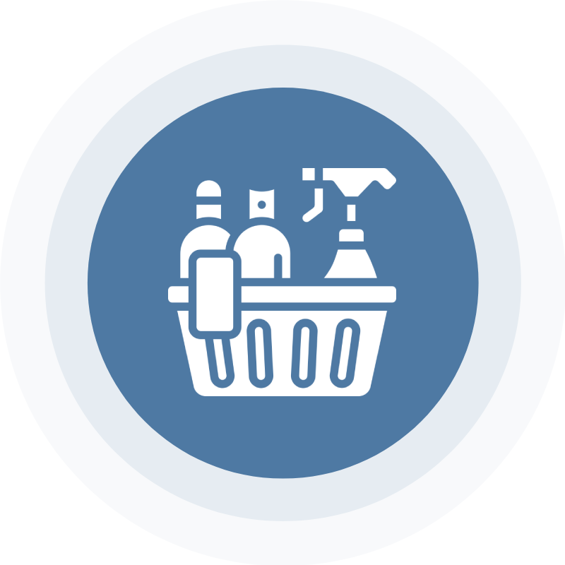 A basket of cleaning supplies on top of a blue circle.